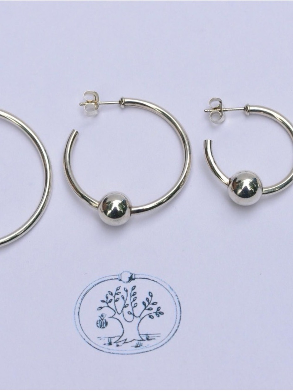 Classic Silver Hoop Earrings with Polished Ball Accent